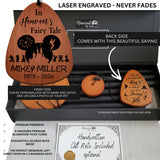 Personalized wooden memorial keepsake set in a black gift box, including a large teardrop-shaped wooden plaque engraved with a Disney castle and Mickey silhouette, a small round wooden mute tube, and a wooden note card. Text overlays describe laser engraving permanence and product features.